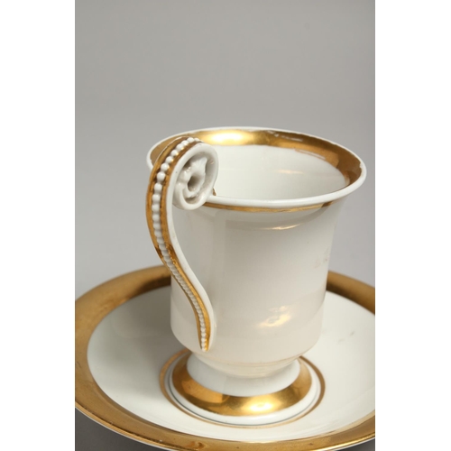 1196 - A 19TH CENTURY BERLIN CUP AND SAUCER, white ground edged in gilt. Sceptre mark in blue.