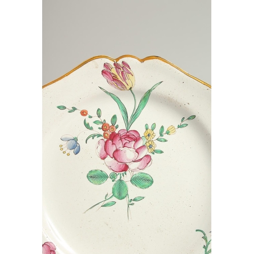 1209 - A 19TH CENTURY FRENCH PLATE painted with flowers. 9ins diameter.