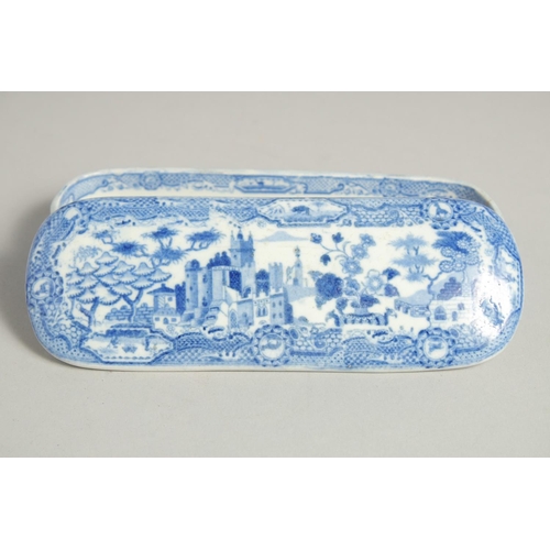 1215 - A BLUE AND WHITE POTTERY BOX AND COVER. 6.5ins long.