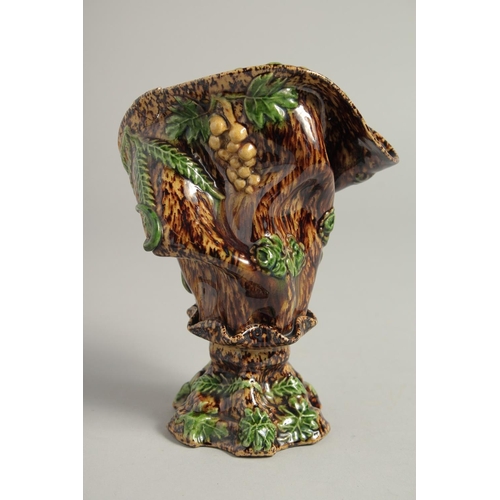 1219 - A SMALL MAJOLICA BROWN GLAZE VASE. 6ins high.