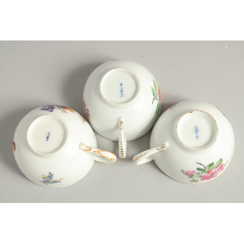 1220 - THREE 19TH CENTURY BERLIN PORCELAIN CUPS painted with flowers. Sceptre mark in blue.