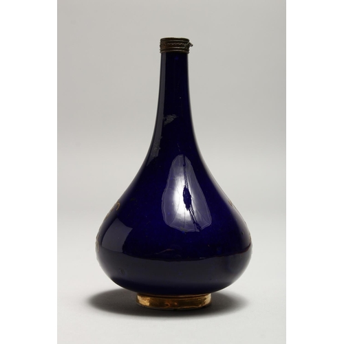 1224 - CHAMBERLAIN & CO. WORCESTER, a small porcelain bottle vase, rich blue ground painted with a panel of... 