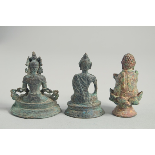 1232 - THREE SMALL INDIAN BRONZE BUDDHAS. 6cm high