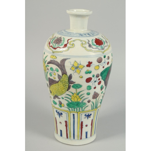 1249 - A CHINESE VASE decorated with fish. 14ins high.