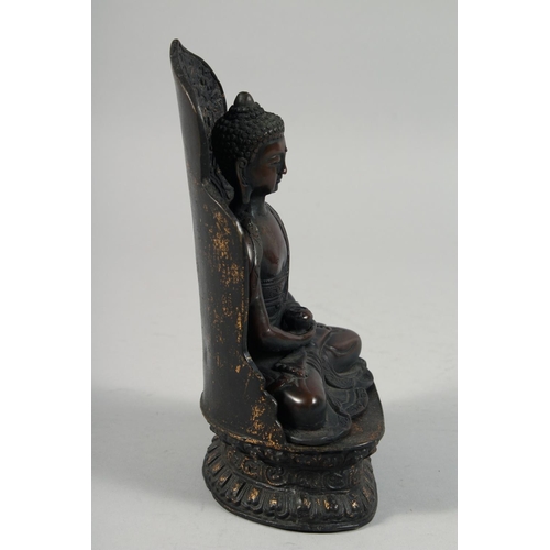 1254 - A BRONZE FIGURE OF SEATED BUDDHA, rested on a detachable base.  22cm high overall.