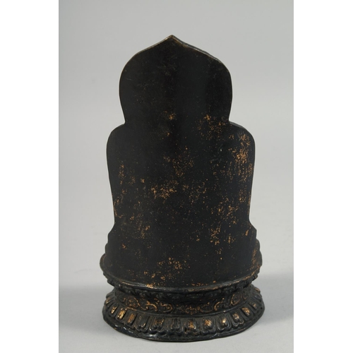 1254 - A BRONZE FIGURE OF SEATED BUDDHA, rested on a detachable base.  22cm high overall.