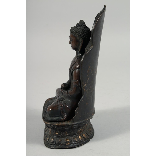 1254 - A BRONZE FIGURE OF SEATED BUDDHA, rested on a detachable base.  22cm high overall.