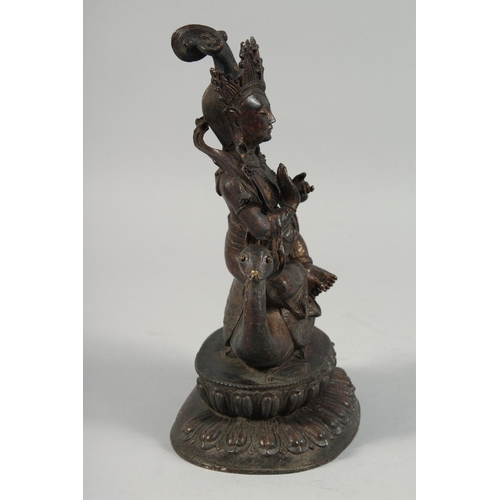 1255 - A LARGE BRONZE FIGURE OF A SEATED DEITY, sat upon a bird and on a lotus base, with traces of gilt, 2... 