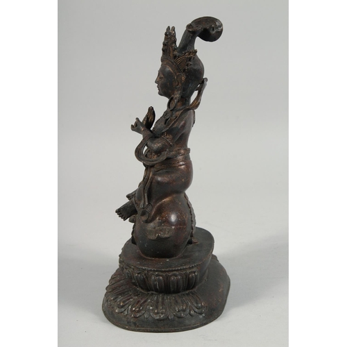 1255 - A LARGE BRONZE FIGURE OF A SEATED DEITY, sat upon a bird and on a lotus base, with traces of gilt, 2... 