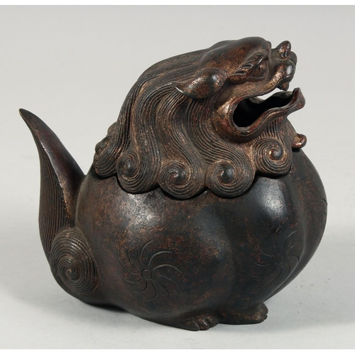 1256 - A CHINESE BRONZE BULBOUS LION DOG LIDDED CENSER, with traces of gilt and red paint, the head as a de... 