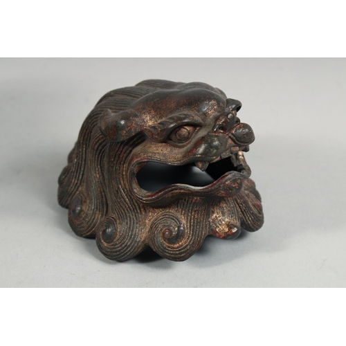 1256 - A CHINESE BRONZE BULBOUS LION DOG LIDDED CENSER, with traces of gilt and red paint, the head as a de... 