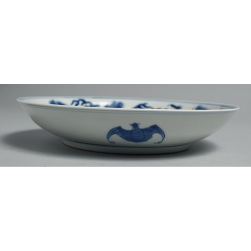 1259 - A CHINESE BLUE AND WHITE PORCELAIN DISH, painted with dragons and the flaming pearl of wisdom, six-c... 