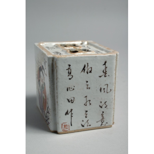 1264 - A CHINESE PORCELAIN INKWELL, painted with figures and script. 10cm wide.