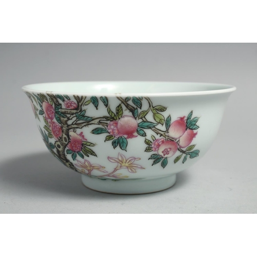 1265 - A CHINESE FAMILLE ROSE PORCELAIN BOWL, painted with pomegranate blossom and birds, the base with fou... 