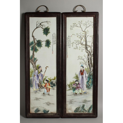 1272 - A PAIR OF MAHOGANY FRAMED CHINESE PORCELAIN PLAQUES. 28ins long x 8ins wide