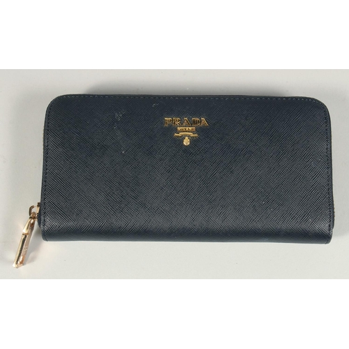 1538 - A PRADA BLACK LEATHER PURSE 7ins x 3.5ins.