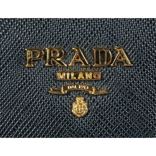 1538 - A PRADA BLACK LEATHER PURSE 7ins x 3.5ins.