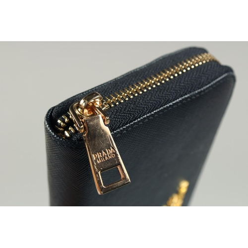 1538 - A PRADA BLACK LEATHER PURSE 7ins x 3.5ins.