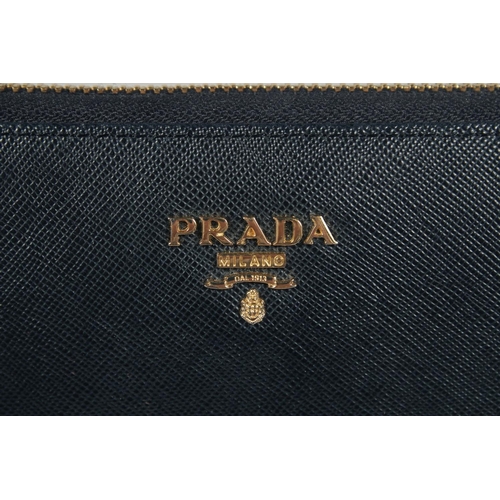 1539 - A PRADA BLACK LEATHER PURSE 7ins x 3.5ins.