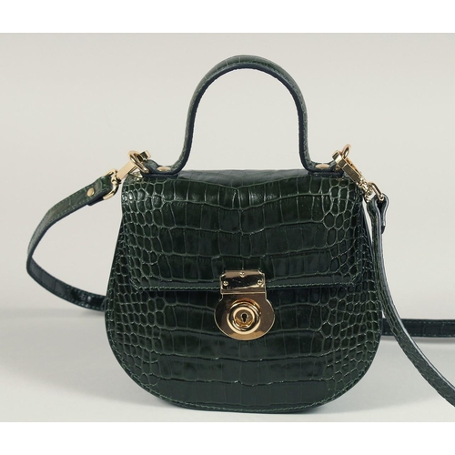 1544 - A SAGE BROWN - GREEN CROCODILE BAG. 7.25ins x 7.5ins with handles and long leather straps.