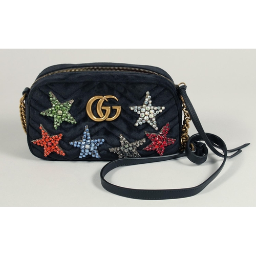 1546 - A GUCCI BLACK VELVET LTD. EDITION STAR BAG. 9.5ins x 5ins with a double 'G' and six coloured stars, ... 