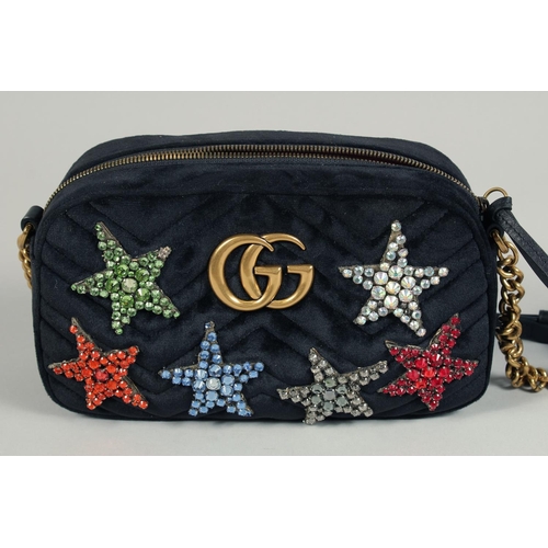 1546 - A GUCCI BLACK VELVET LTD. EDITION STAR BAG. 9.5ins x 5ins with a double 'G' and six coloured stars, ... 