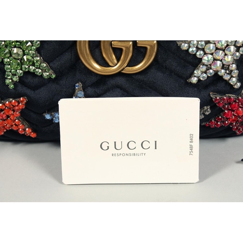 1546 - A GUCCI BLACK VELVET LTD. EDITION STAR BAG. 9.5ins x 5ins with a double 'G' and six coloured stars, ... 