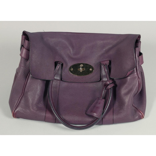 1548 - A LARGE MULBERRY MAUVE SOFT LEATHER BAG. 14ins x 10.5ins with two leather handles.