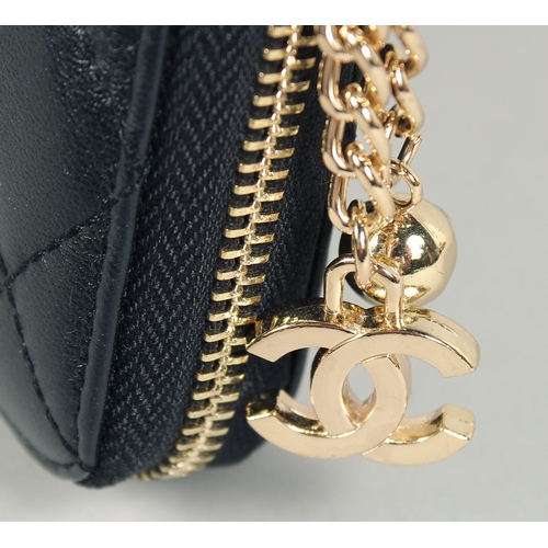 1552 - A CHANEL PADDED LEATHER PURSE, No. 10218184, with a gilt hinge. 7.5ins x 3.5ins.