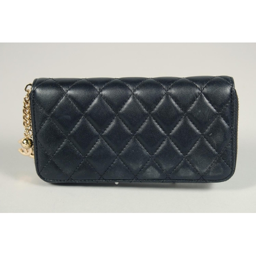 1552 - A CHANEL PADDED LEATHER PURSE, No. 10218184, with a gilt hinge. 7.5ins x 3.5ins.