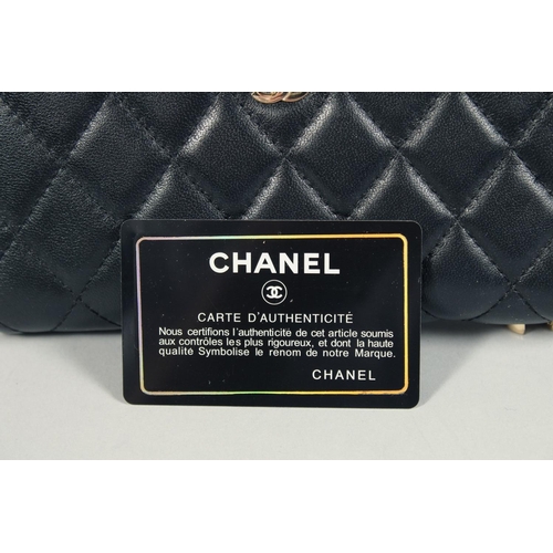 1552 - A CHANEL PADDED LEATHER PURSE, No. 10218184, with a gilt hinge. 7.5ins x 3.5ins.