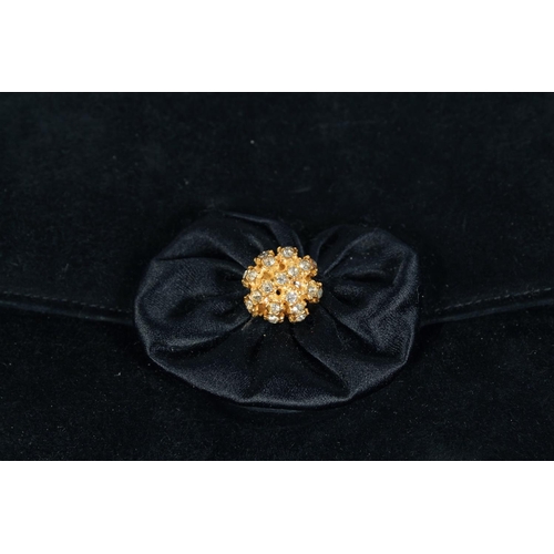 1558 - A BLACK VELVET EVENING BAG 6.5ins x 9.5ins with gilt stud.