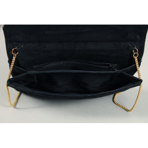 1558 - A BLACK VELVET EVENING BAG 6.5ins x 9.5ins with gilt stud.