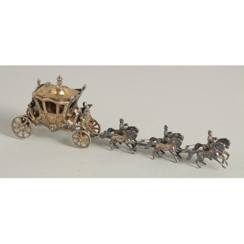 1916 - A CONTINENTAL SILVER GILT CORONATION COACH AND HORSES. 7ins long