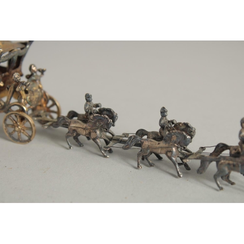 1916 - A CONTINENTAL SILVER GILT CORONATION COACH AND HORSES. 7ins long