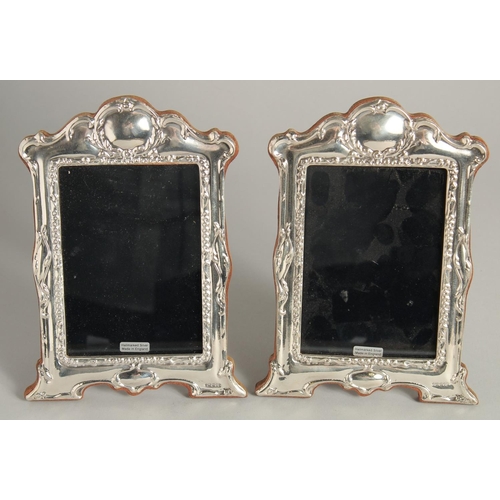 1918 - A PAIR OF SILVER PHOTOGRAPH FRAMES 7ins high.