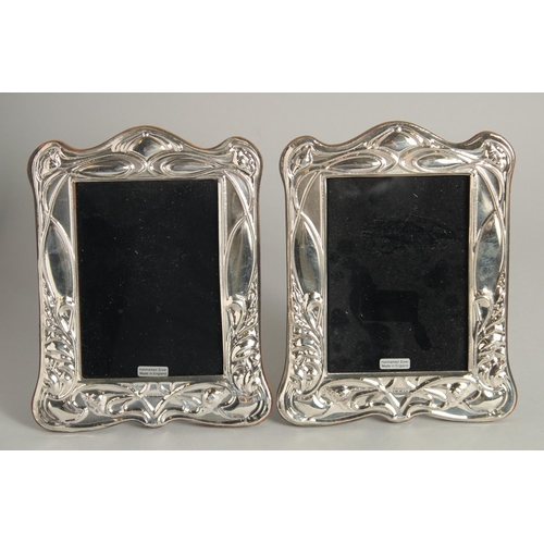 1919 - A PAIR OF SILVER PHOTOGRAPH FRAMES. 7ins high.