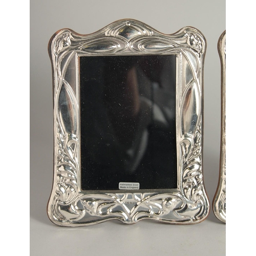 1919 - A PAIR OF SILVER PHOTOGRAPH FRAMES. 7ins high.