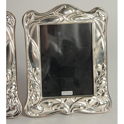 1919 - A PAIR OF SILVER PHOTOGRAPH FRAMES. 7ins high.