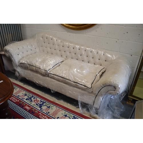 1062 - A VERY GOOD SCROLL ARM HUMPBACK LARGE TWO SEATED SETTEE, recently re-upholstered to a high standard.