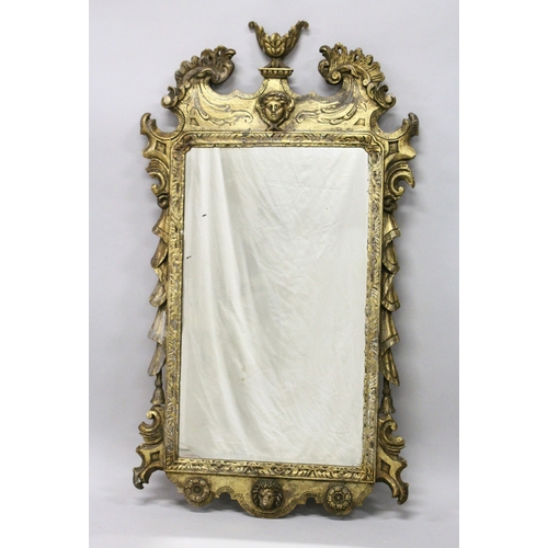 1003 - A GOOD GEORGE III DESIGN CARVED WOOD AND GILDED MIRROR with acanthus scrolls, masks, and urns. 3ft 1... 