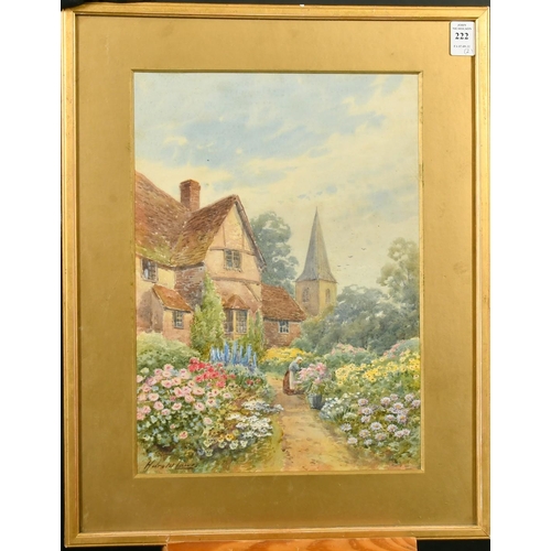 222 - Harold Lawes (1865 - 1940) British, a lady tending flowers in a cottage garden, watercolour, signed,... 