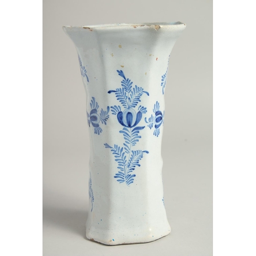 1169 - A DUTCH BLUE AND WHITE TIN GLAZE VASE with figures in a landscape. 9ins high.