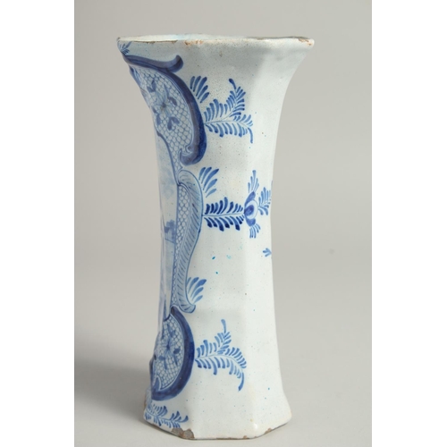 1169 - A DUTCH BLUE AND WHITE TIN GLAZE VASE with figures in a landscape. 9ins high.