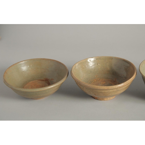 1179 - FIVE VARIOUS CELADON GLAZED BOWLS. 5.5ins diameter.