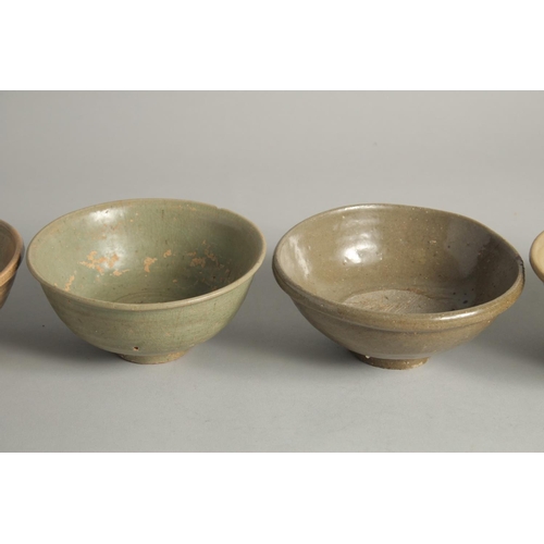 1179 - FIVE VARIOUS CELADON GLAZED BOWLS. 5.5ins diameter.