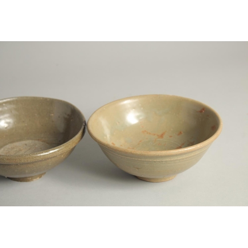 1179 - FIVE VARIOUS CELADON GLAZED BOWLS. 5.5ins diameter.