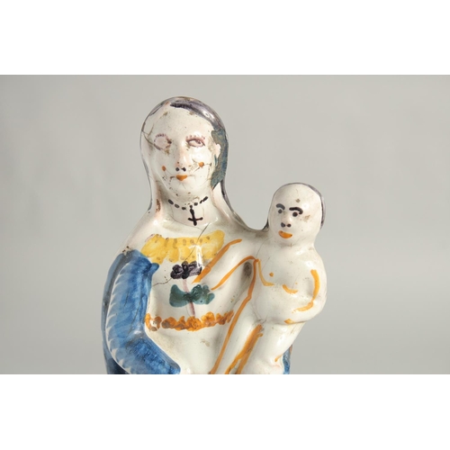 1184 - AN 18TH CENTURY FIANCE POTTERY FIGURE, Madonna and child. 12ins high.