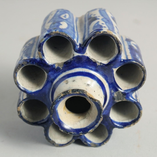 1187 - AN EARLY ISLAMIC POTTERY EIGHT DIVISION INKWELL. 3.5ins diameter.