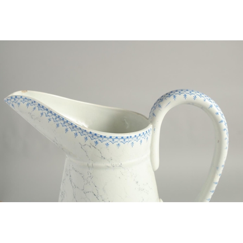 1188 - A LARGE LUNEVILLE POTTERY JUG with blue pattern. 15ins high.